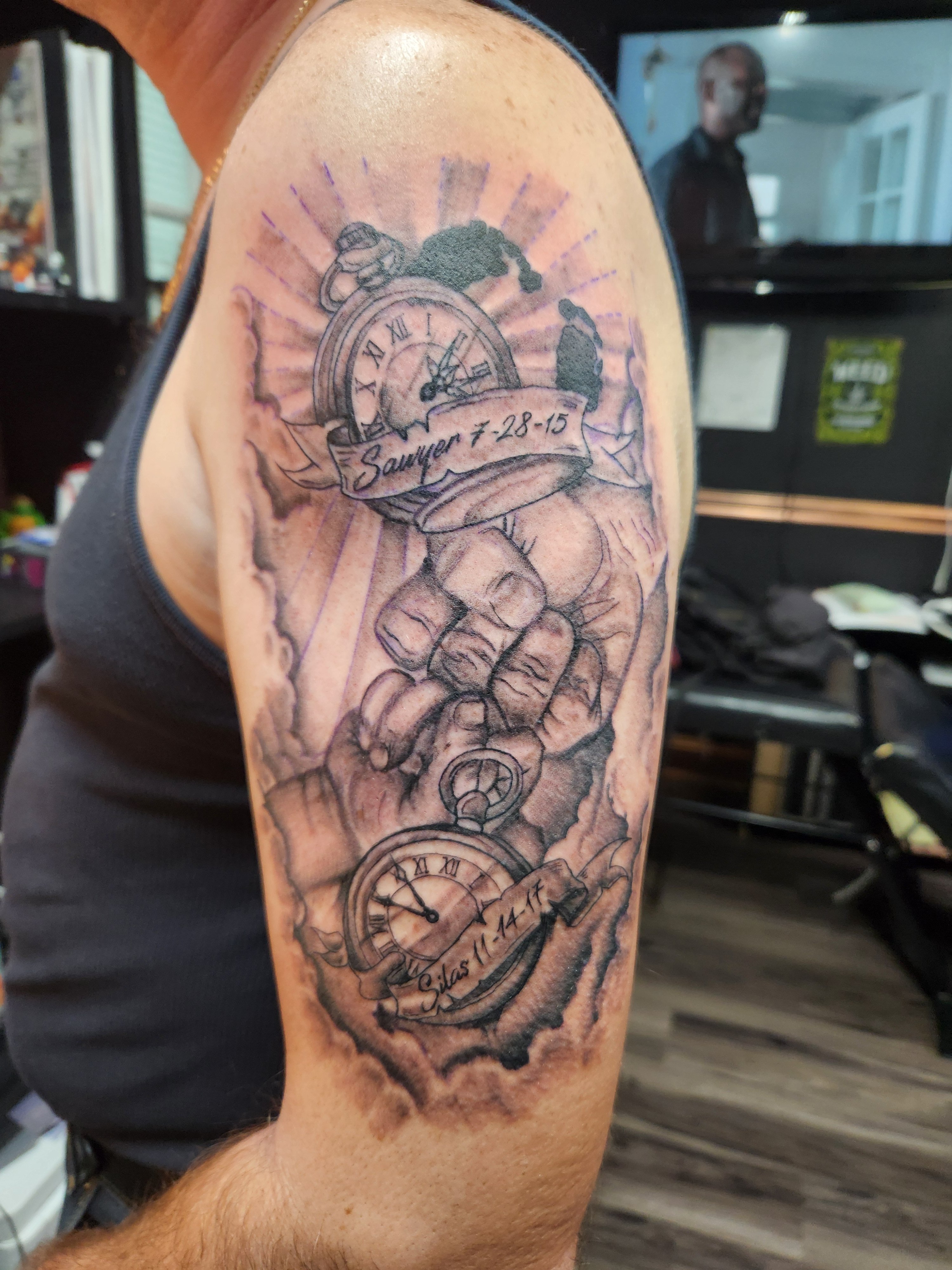 Clocks, Dad & Son fist bumps, divine light, clouds and late baby foot prints done in Black and gray