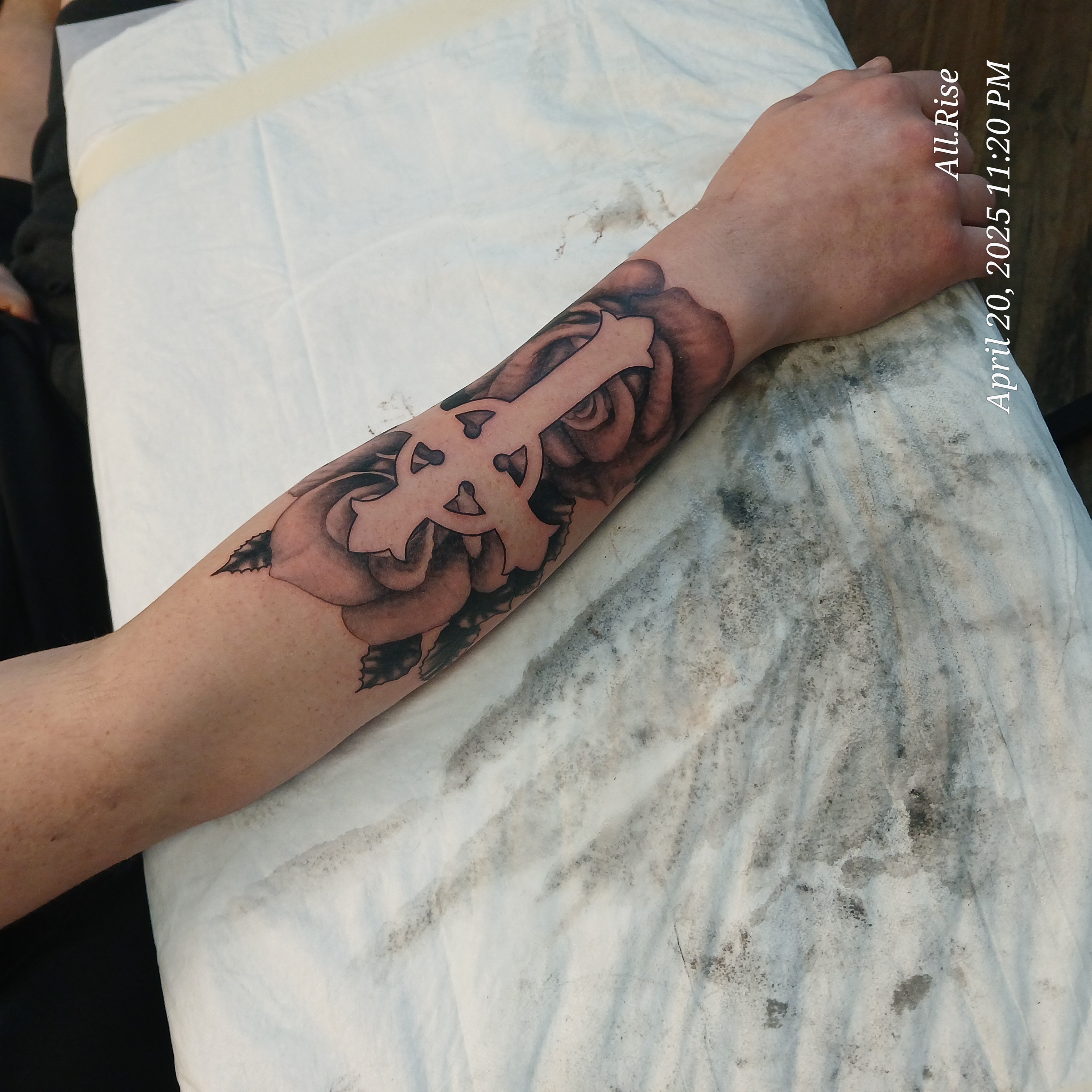 Negative space cross and roses