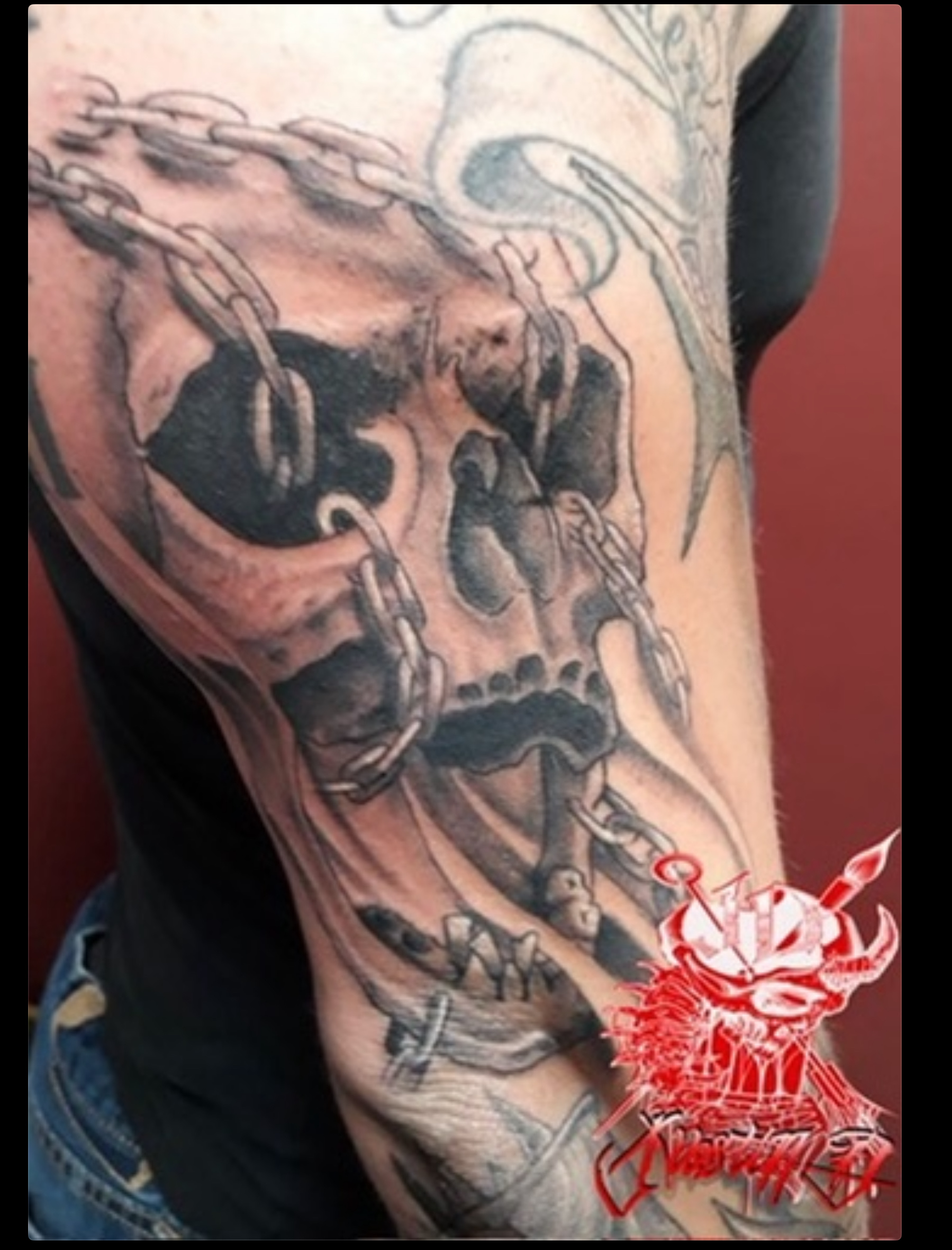 Skull and chain custom tattoo