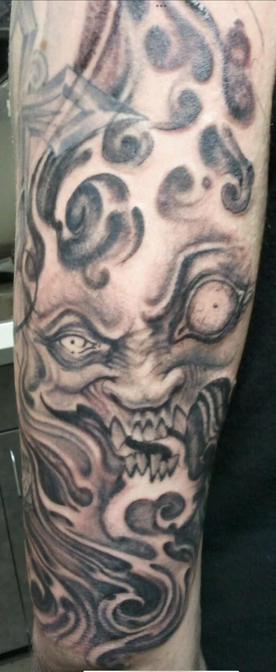 Black and gray free hand demon