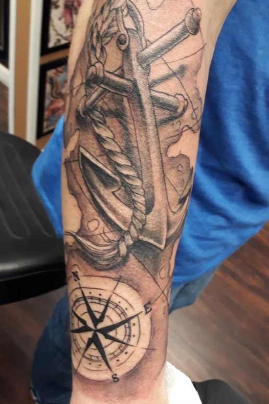 Black and gray anchor with rope